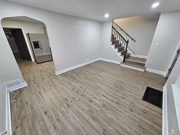 Spacious family room with gleaming luxury vinyl floorings.