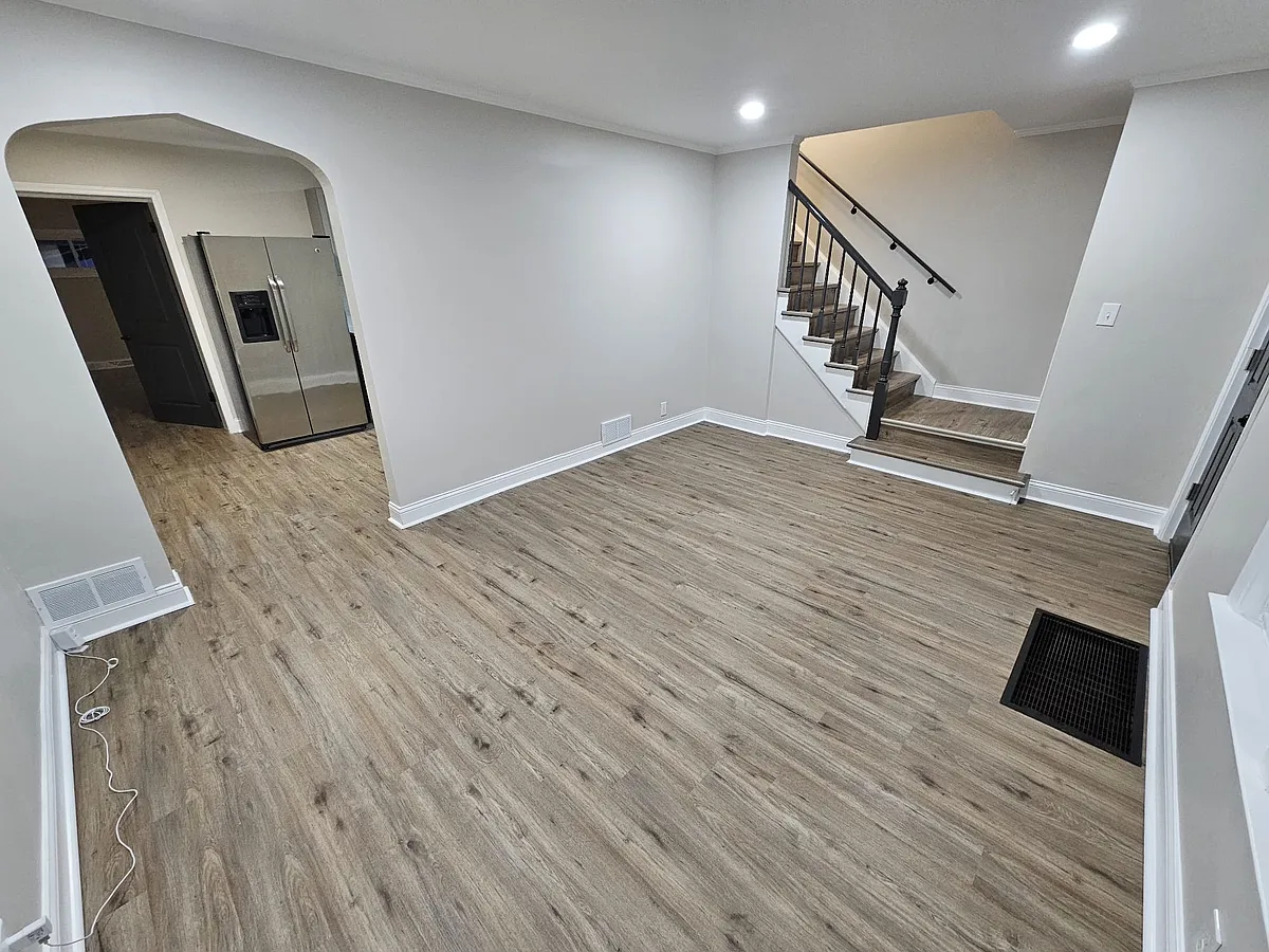 Spacious family room with gleaming luxury vinyl floorings. - 2110 S 23rd Ave