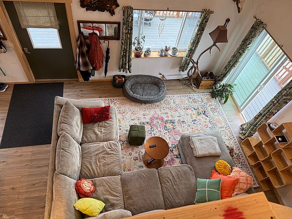Overview from the large loft showcasing large living space that flows from kitchen and dining area
