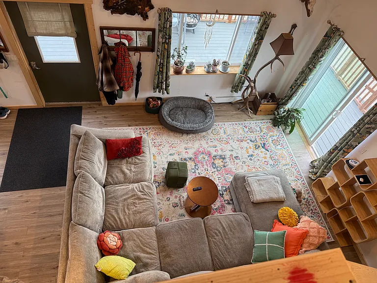 Overview from the large loft showcasing large living space that flows from kitchen and dining area