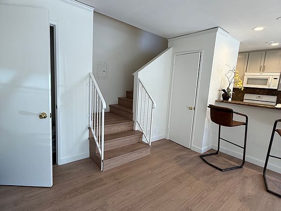 Stairs leading upstairs to 2 bedroom suites.