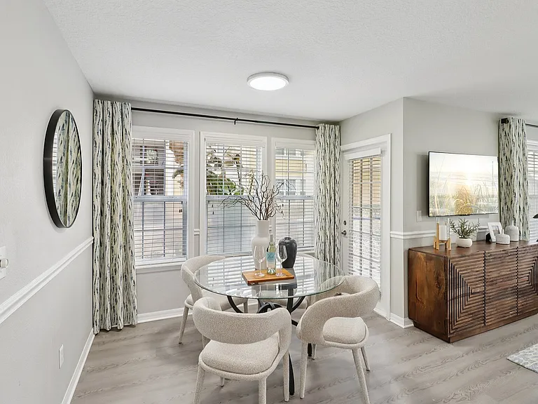 Bright dining space with elegant seating and natural light