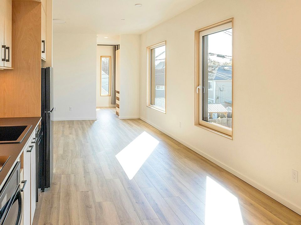 Kitchens feature Richlite countertops, a solid surface material made from recycled paper and resin sustainably manufactured in Washington state by a hometown Tacoma company