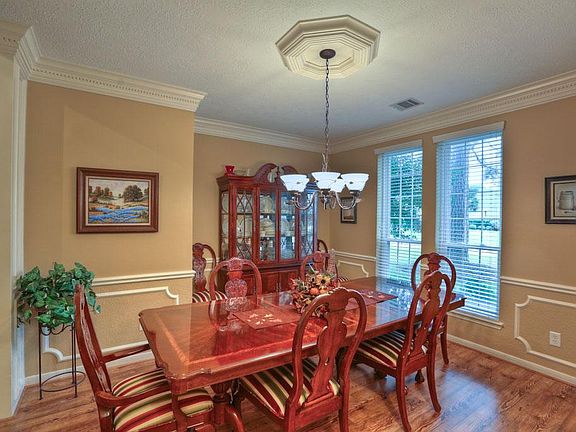 Large picture windows make this an inviting space to entertain. Notice the attention to detail.