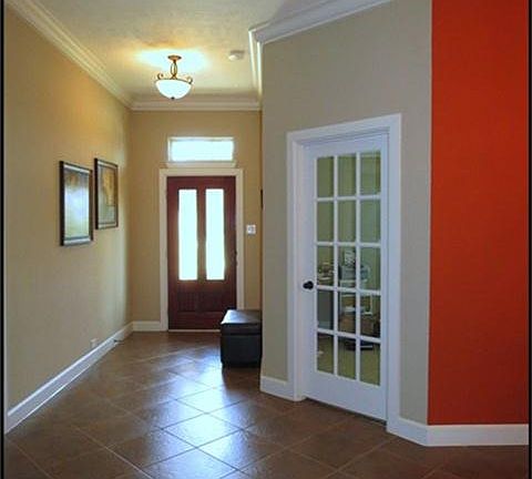 Entry with tile floors and lead glass front door.