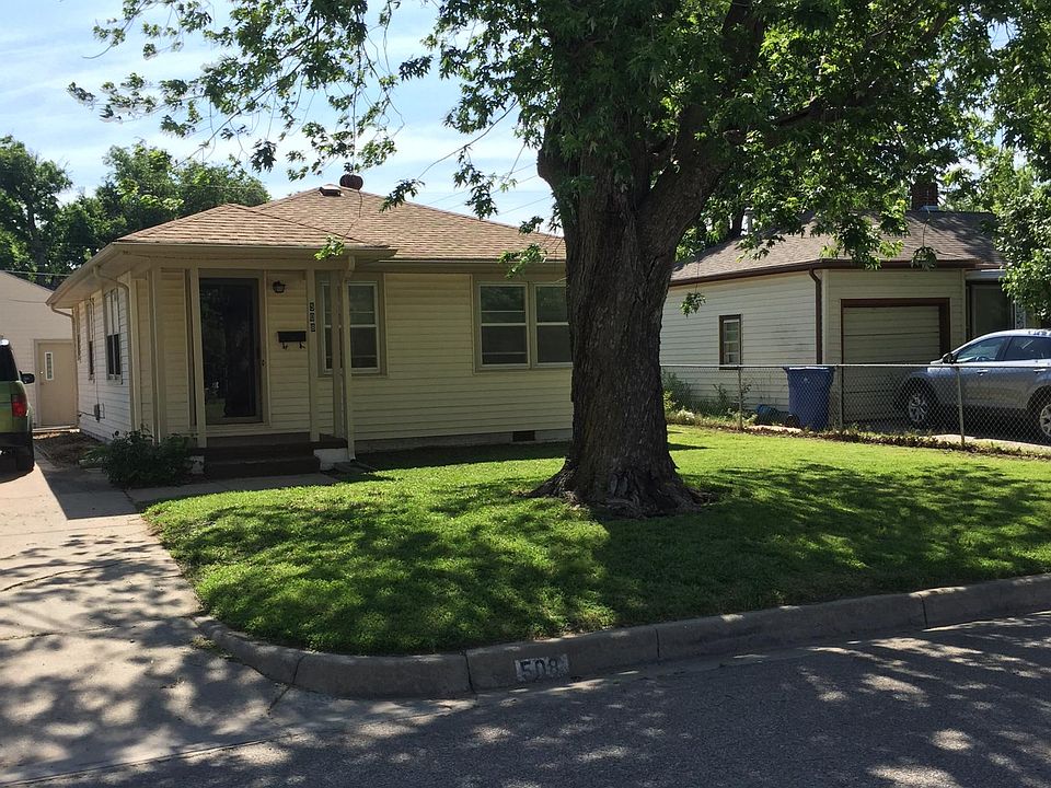 Nice front yard, with shade tree