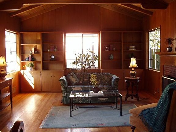 Lovely living room with cathedral ceilings & handsome fireplace