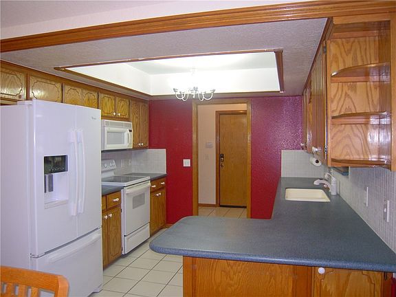 Full kitchen leading into laundry area.Fridge is 3 yrs old & negotiable.