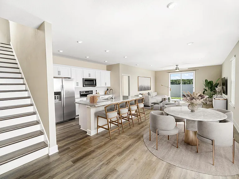 An airy, open first floor at Amavi Kissimmee offers plenty of room to gather, with easy access to nearby parks, shopping, and everyday conveniences.