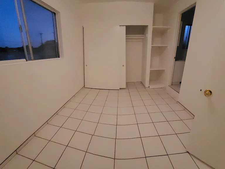 Bedroom looking towards wall to wall closet