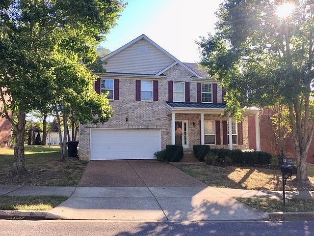 Front of house, 2- car garage.