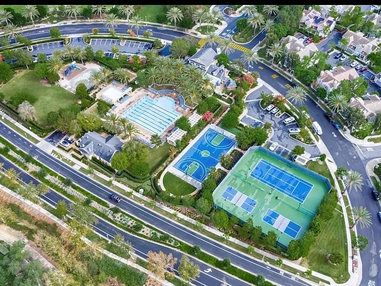 Resort-style HOA amenities including a pool, tennis courts, basketball courts, parks, and green spaces.