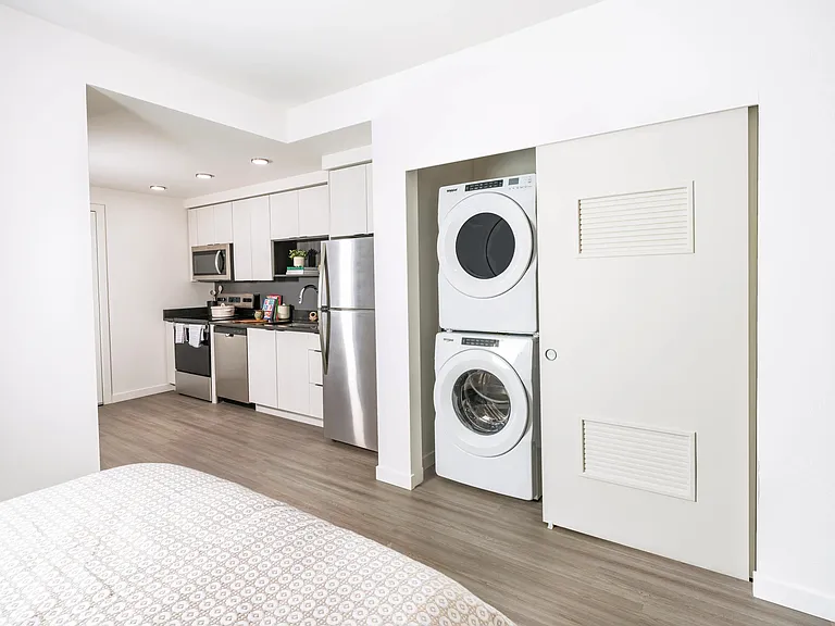 Enjoy the convenience of in-home laundry at Modera Woodstock, featuring a full-size washer and dryer for effortless living.
