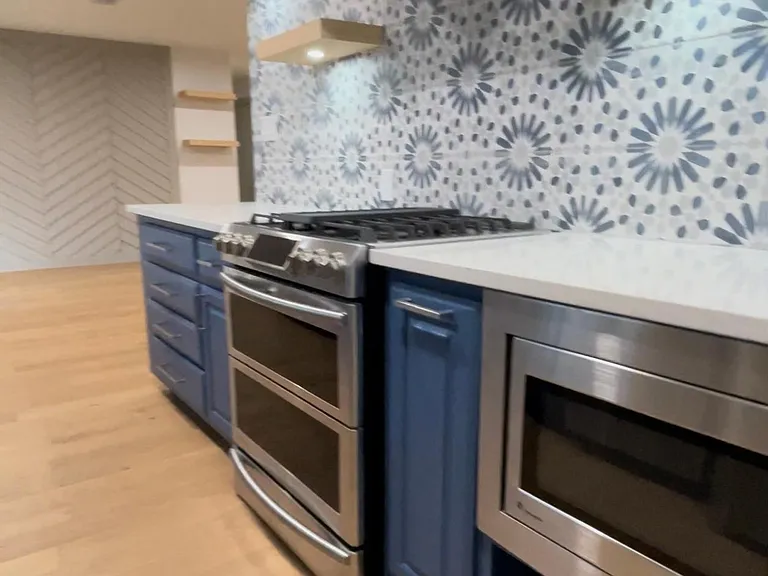 Gas and electric stove with spice cabinet pullout