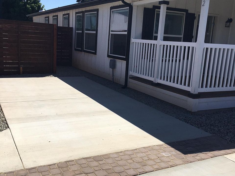 Front and side view of home and parking area