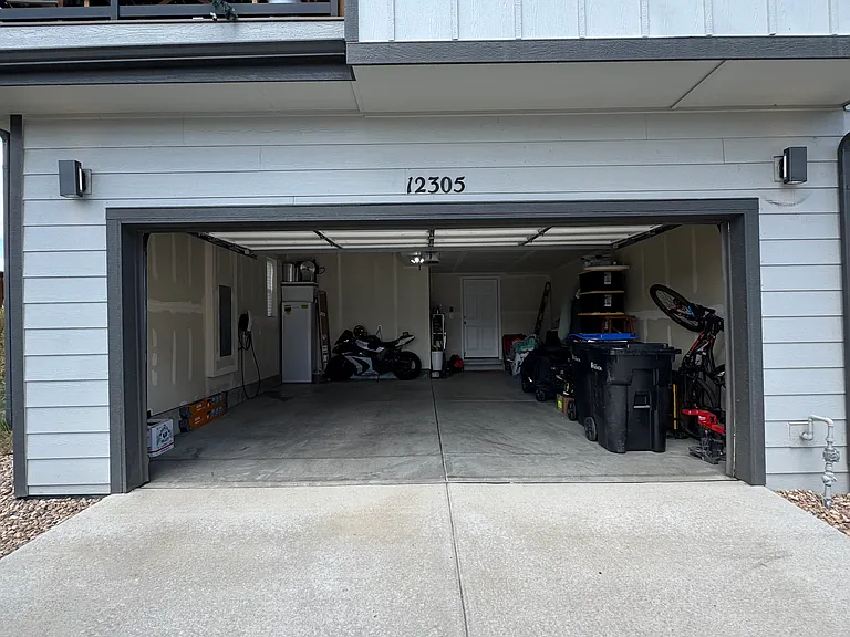 2-car garage with EV charging and additional freezer storage