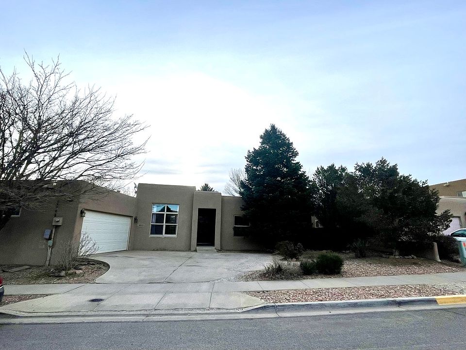 Street view of the house, with attach garage.