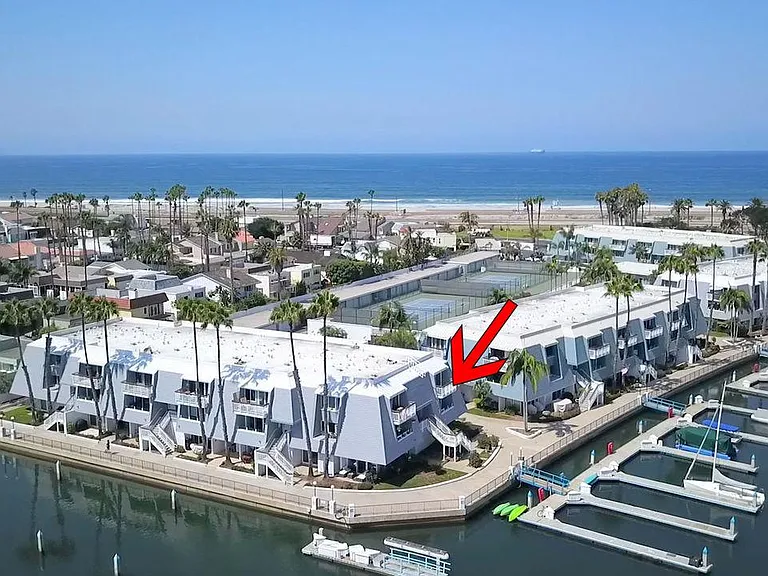 Upper corner end unit, overlooking marina & bay.