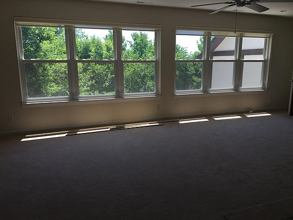 Unit B lving area ample natural light and private/scenic vi