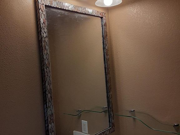 Bathroom with recessed lighting and over mosaic mirror lighting