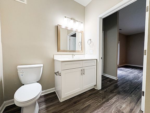 Newly renovation bathroom with white granite vanity and stainless steel finishes.