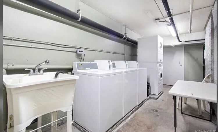 Basement Laundry Area with Washers and Dryers open 24 hours and Locked Entrance.