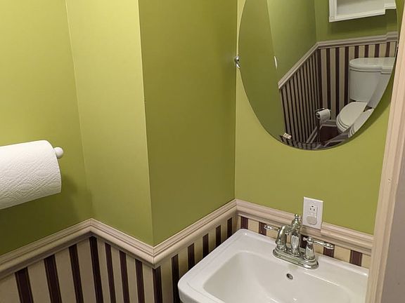 Half Bathroom Toilet and Mirror.