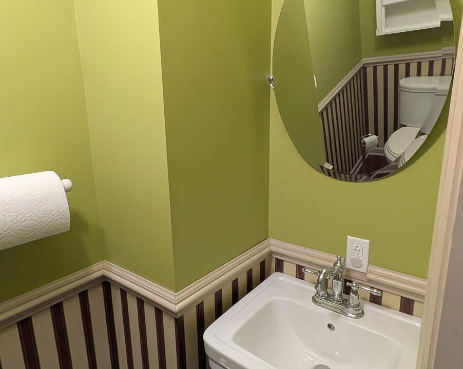 Half Bathroom Toilet and Mirror.