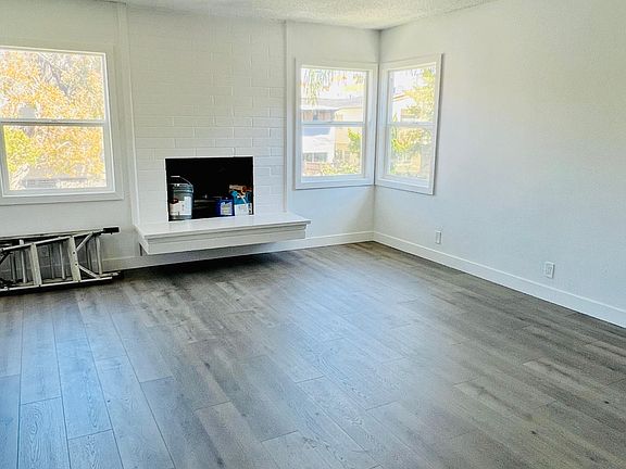 Another view of the living room and fireplace