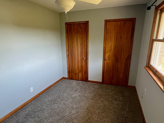 Bedroom with ceiling fan.