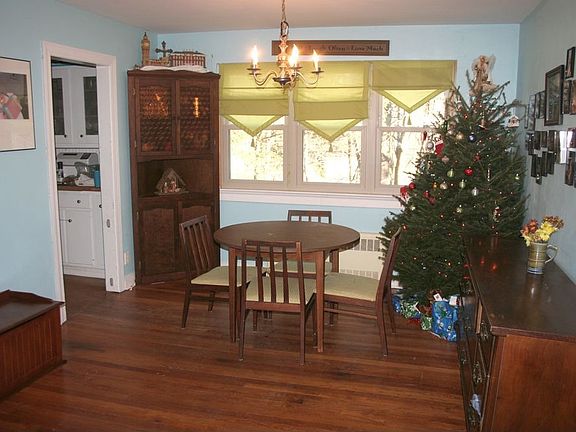 Dining room area with entrance to kitchen