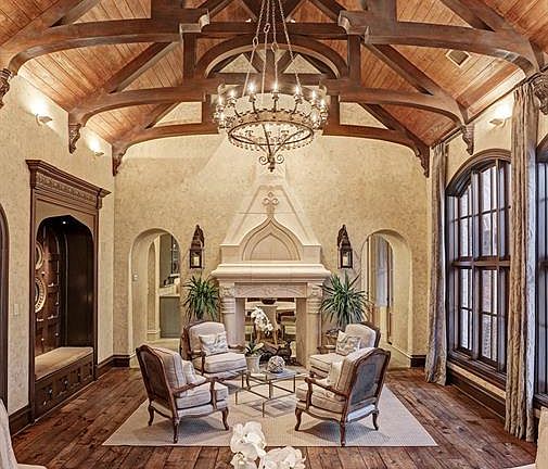 Upon entering the great room, it takes your breath away! Massive 19' cathedral ceiling, floor-to-ceiling arched windows, grand h