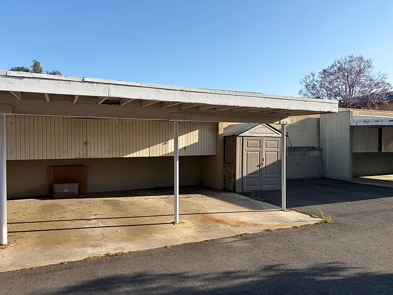 Single Parking Space with storage above.