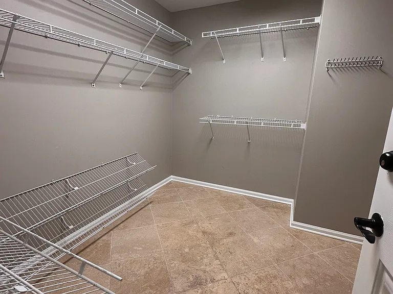 Large Master Closet with plenty of hanging space and lower shelving for your shoes!