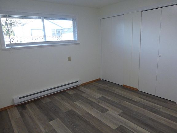 Larger back bedroom with large closet and bi-folding doors.