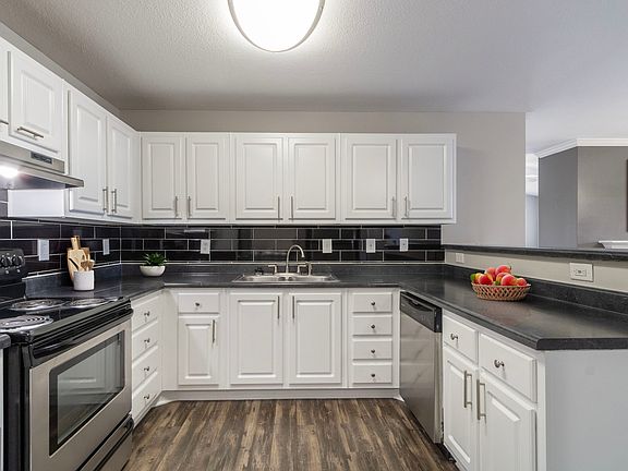 Kitchen corner with clean cabinetry and open prep space