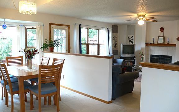 Dining Room & Family Room w/ Gas Fireplace and Backyard access via Garden Door