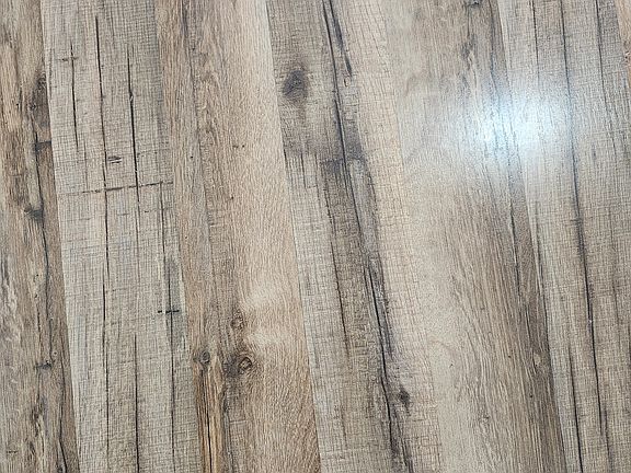 Close-up view of laminate/tile which is in most rooms/areas.
