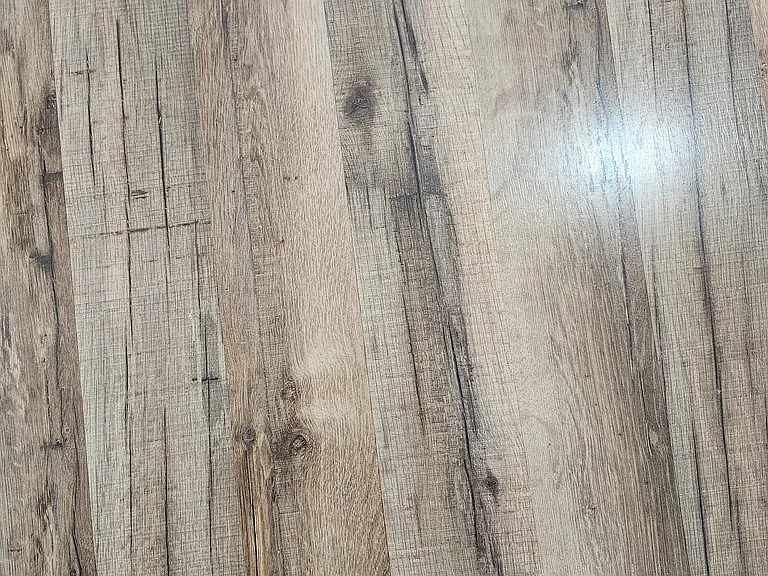 Close-up view of laminate/tile which is in most rooms/areas.
