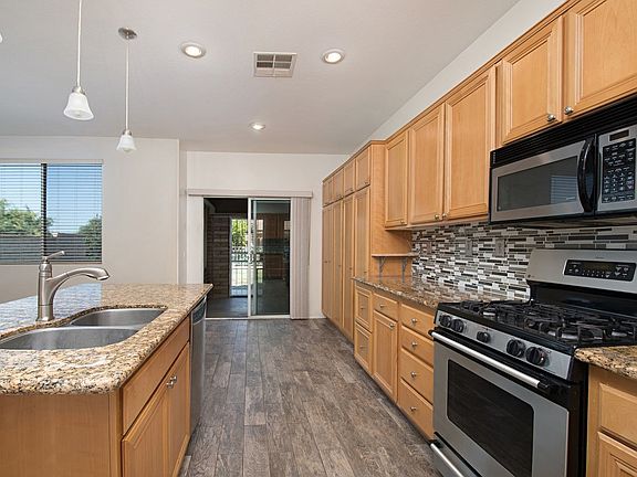 Kitchen with view to dining and patio