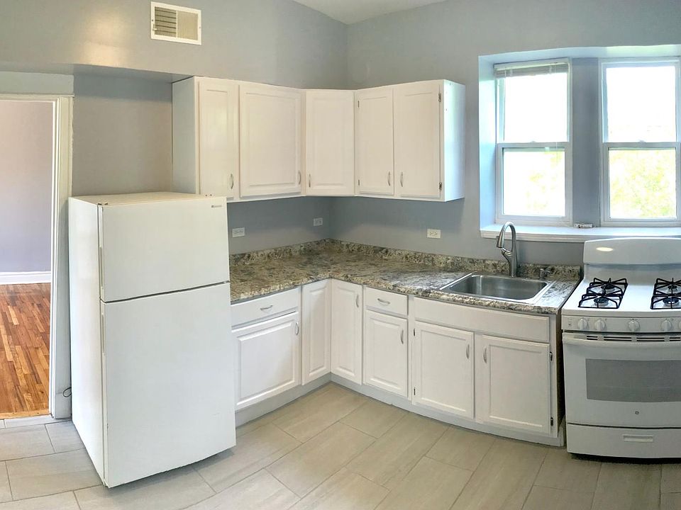 Large kitchen (includes stove & fridge) with dinette and clo