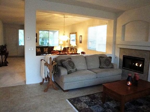 Family Room w/ Fireplace looks into Living Rm