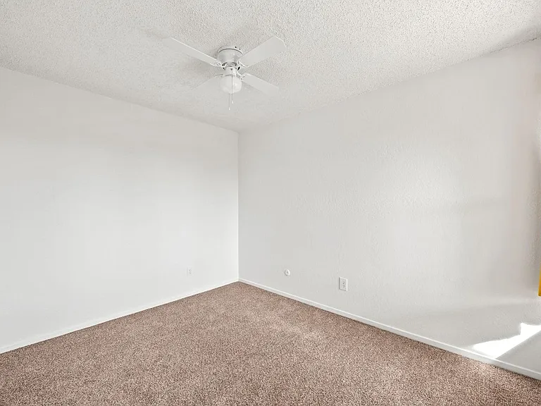 Bedroom with new carpet.