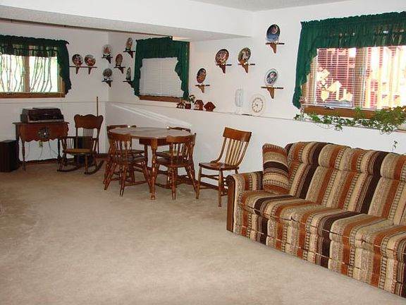 Extra large family room on lower level with views of beautiful backyard.