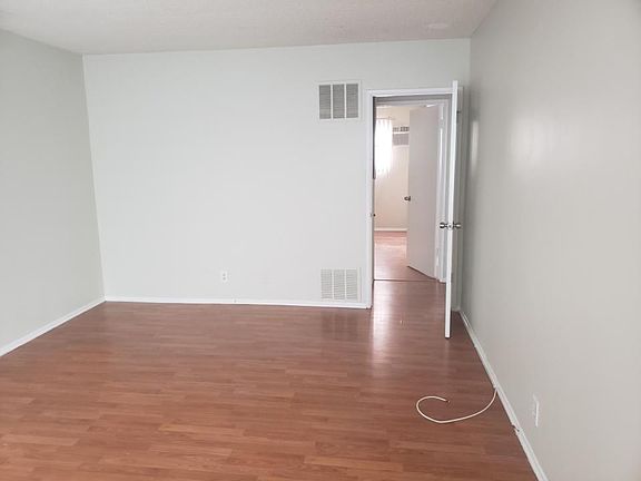 Living room with shades open and natural light coming through.