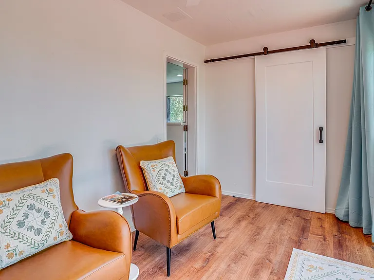 Sitting area in sunroom, door to closet