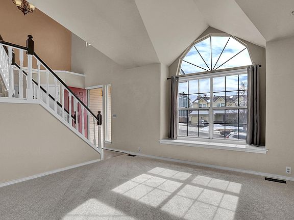Front living room, brand new carpet in the entire home.