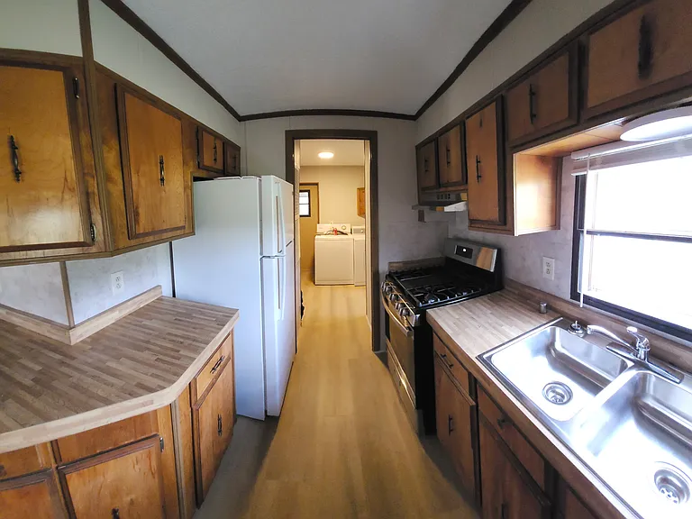 L-Shaped kitchen with new appliances laundry/mud room
