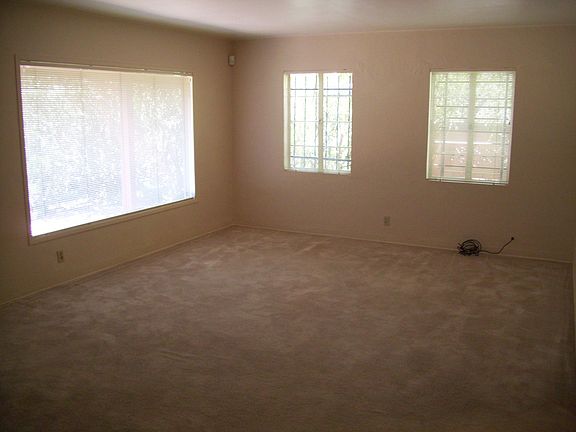 Living Room (opposite view); picture windows shaded