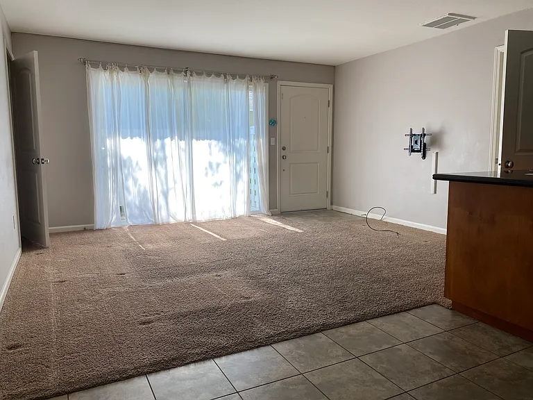 Living room, front door, patio door, view from dining room